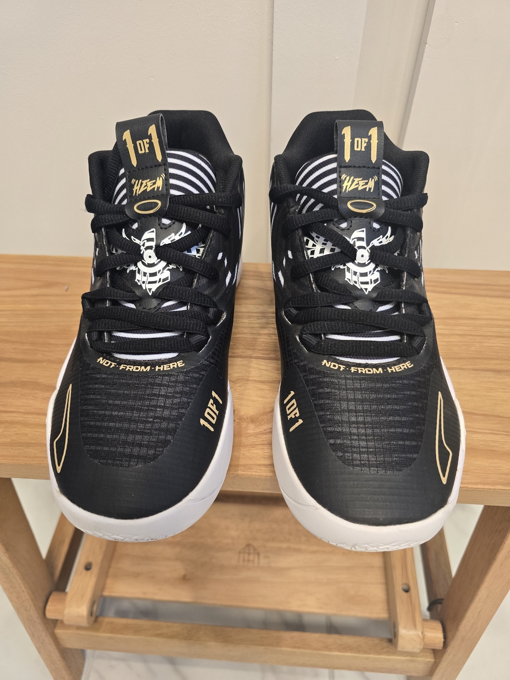 Puma Kids Black and White Sneakers with Gold Accents